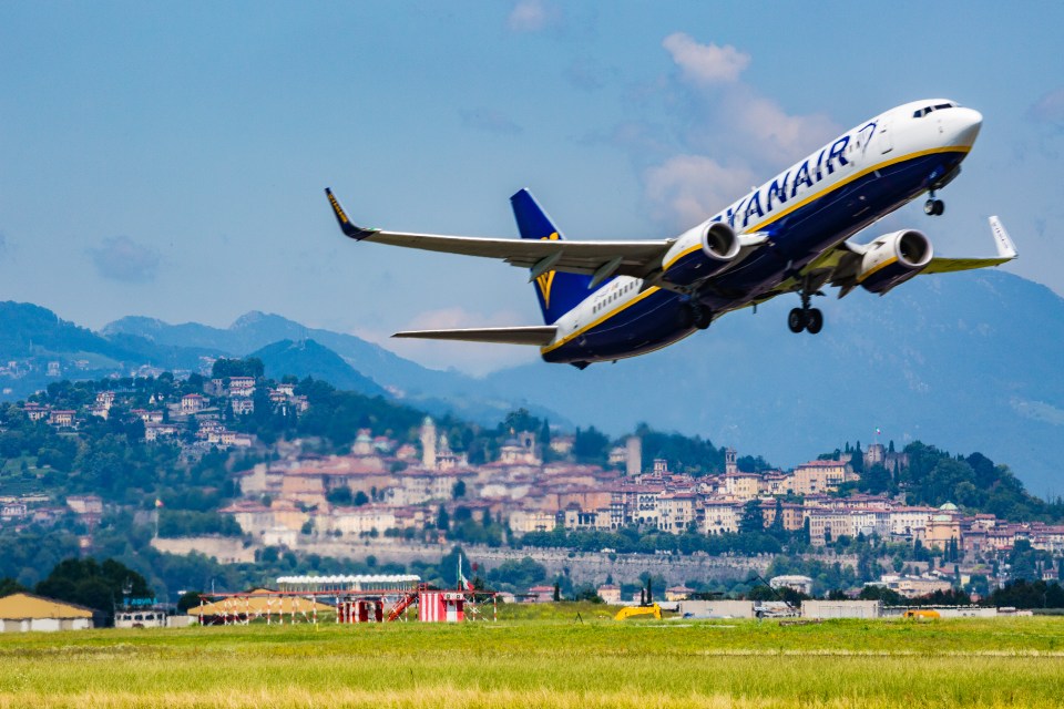 Ryanair plane taking off over Bergamo, Italy.