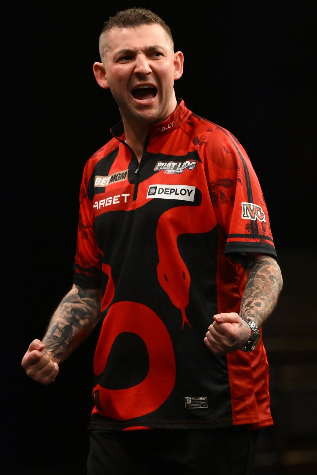 Nathan Aspinall celebrating a quarter-final win.