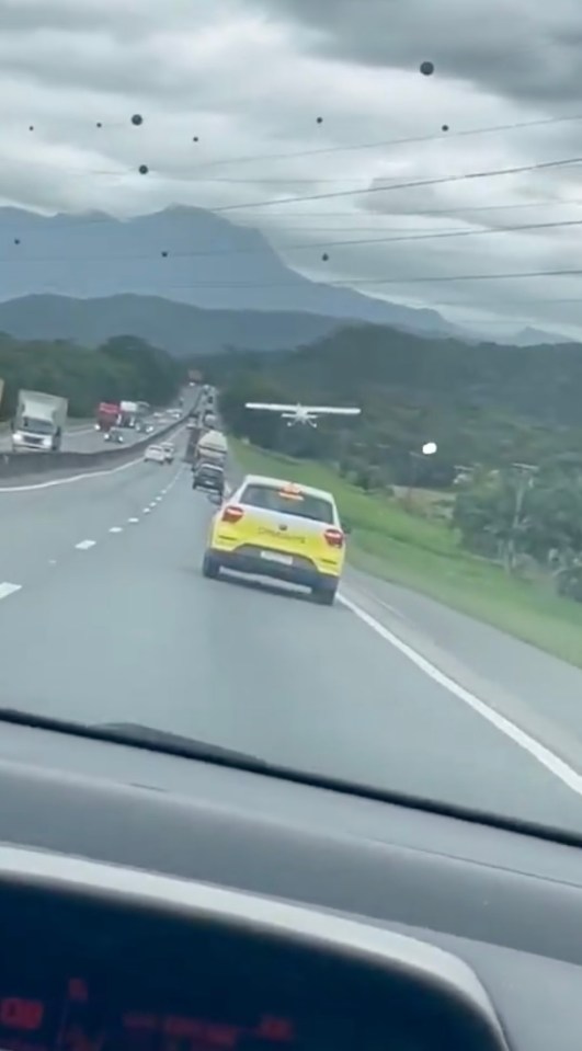 Plane making an emergency landing on a highway.