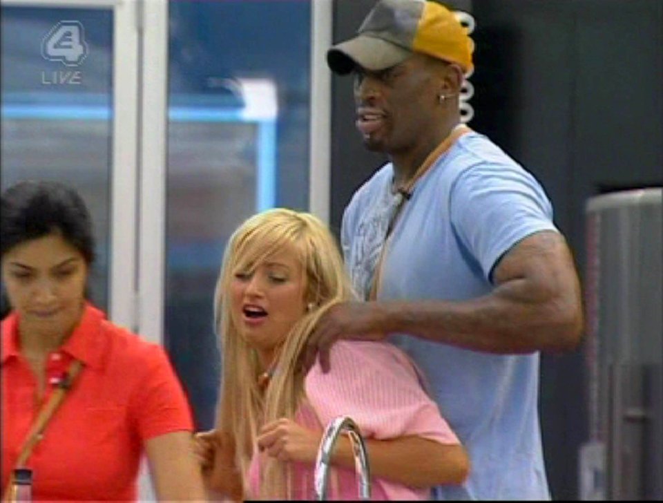 Screenshot from Celebrity Big Brother showing Dennis grappling with Chantelle.