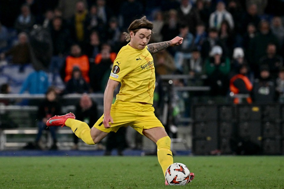Patrick Berg kicking a soccer ball during a penalty shootout.