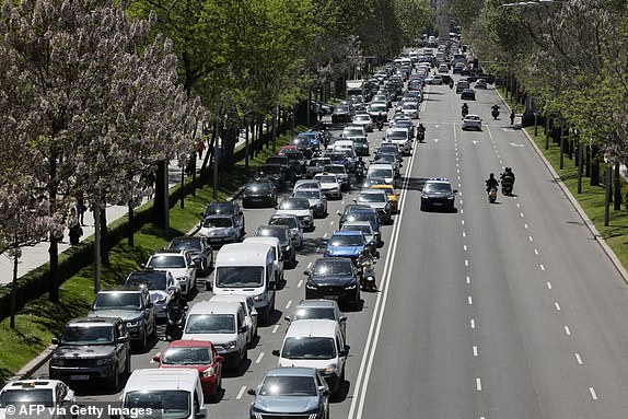 A Police car officers (R) patrols under switched-off traffic lights during a massive power cut affecting the entire Iberian peninsula and the south of France, in Madrid on April 28, 2025. A "massive" power cut late on April 28, 2025 morning affected the whole of the Iberian peninsula and part of France, according to Portuguese electricity network operator REN. (Photo by OSCAR DEL POZO / AFP) (Photo by OSCAR DEL POZO/AFP via Getty Images)