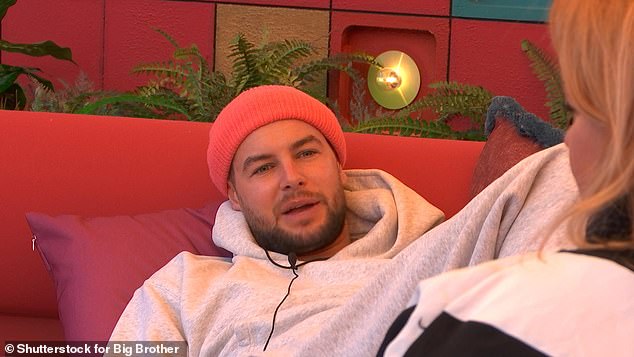 According to reports he was spotted arriving at the airport in a oversized grey hoodie and pink beanie hat, both of which Chris wore in the house (pictured)