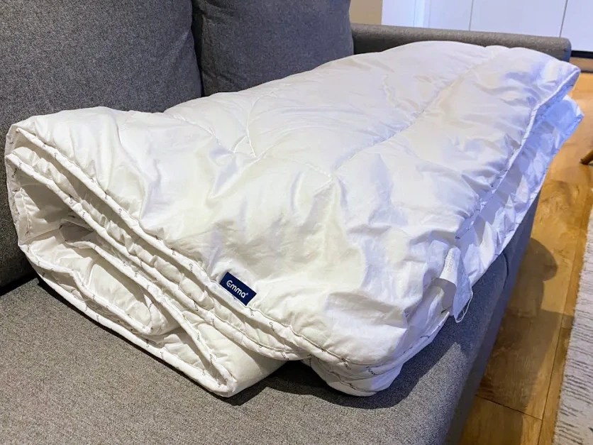 Emma Cloud duvet folded on a couch.