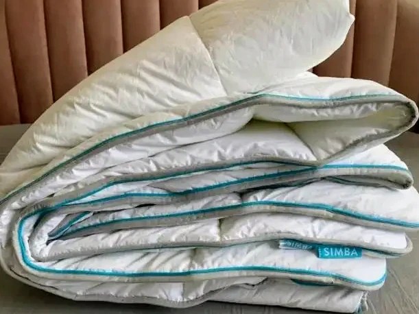 Simba Hybrid duvet folded on a bed.