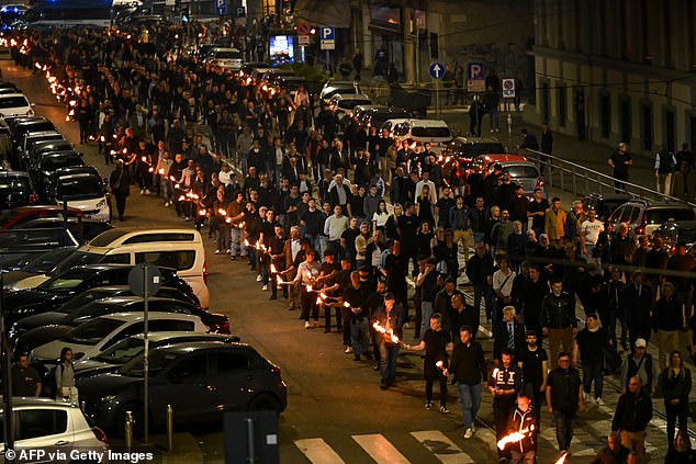 Members of the Italian Social Movement (MSI) lit torches, held banners and set off fire crackers in Milan yesterday evening