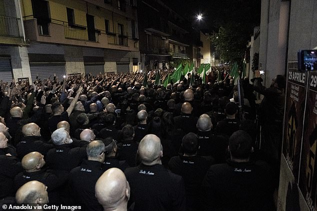 Far-right militants perform the fascist salute (with the right arm extended and the hand open) during the commemoration Ramelli's murder