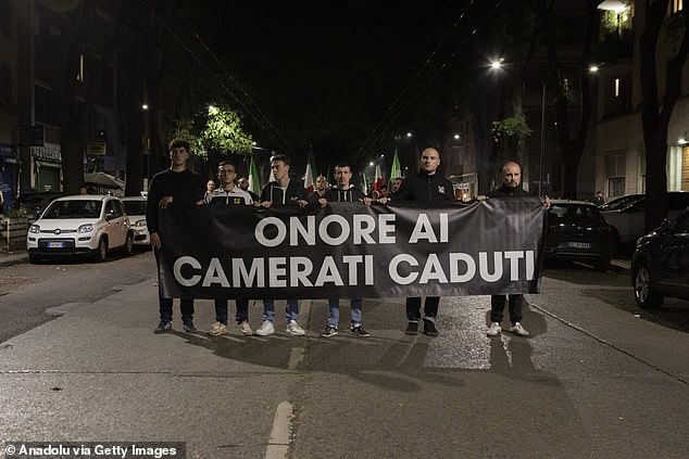 Neo-fascists held up a banner saying 'honour to the fallen comrades'