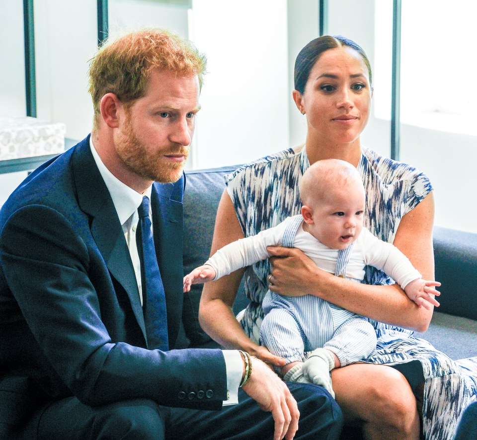 Prince Harry, Meghan Markle, and their baby son.