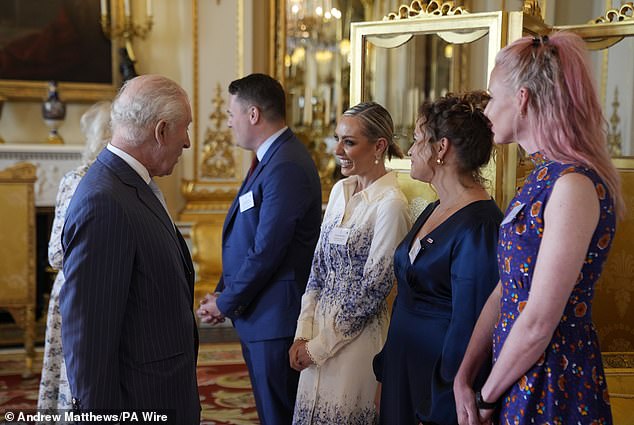 King Charles speaks with ballroom dancer Amy Dowden, actress and broadcaster Giovanna Fletcher and Maren Sheldon, co-founder of CoppaFeel