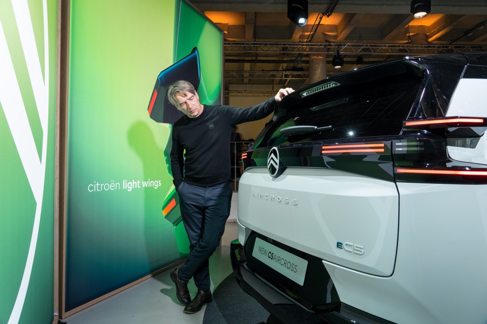 Man standing next to a Citroën C5 Aircross.