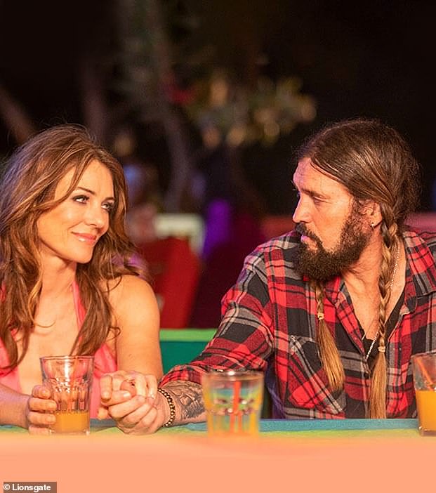 Cyrus and Hurley fatefully met on the set of their 2022 holiday movie Christmas in Paradise, which was shot in the Caribbean (seen above in the film)