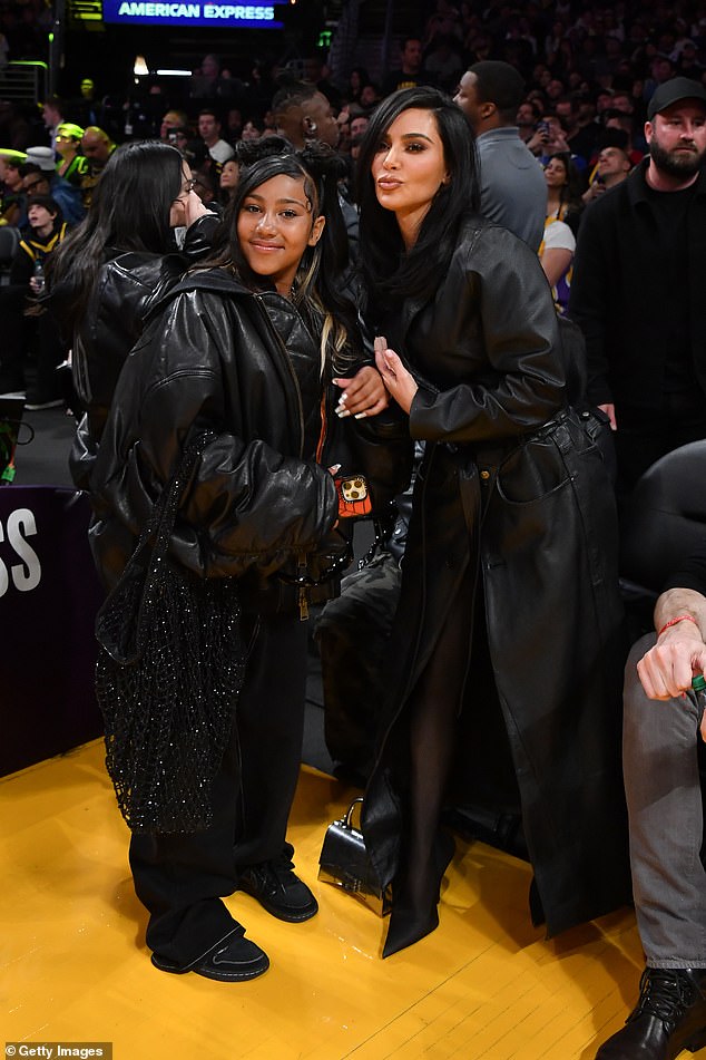 The comments directed at his ex-wife came in reaction to a planned musical collaboration between his daughter North, 11, and rapper Playboi Carti, 28, which he opposes. Kim and North pictured at a Lakers game last April in LA