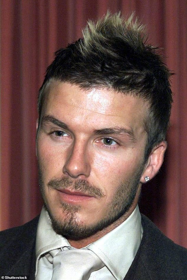 2002: As the Mohican grew out, Becks dyed the tips of it blond. Nine per cent voted for his 'faux-hawk' look