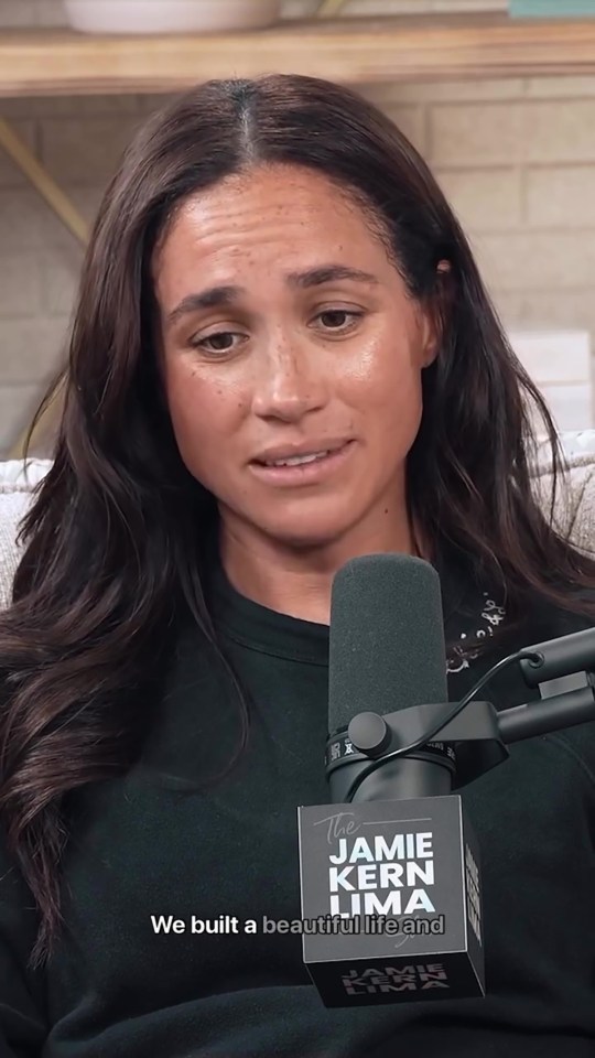 Meghan Markle on a podcast, appearing emotional.