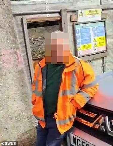 A heritage campaigner says he was attacked by a man in a high vis jacket at an historic gardens used by Agatha Christie in a row over planning