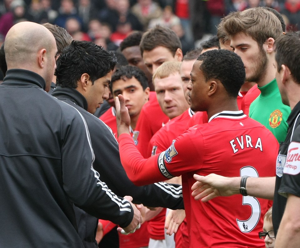 Luis Suárez of Liverpool refusing to shake Patrice Evra's hand.