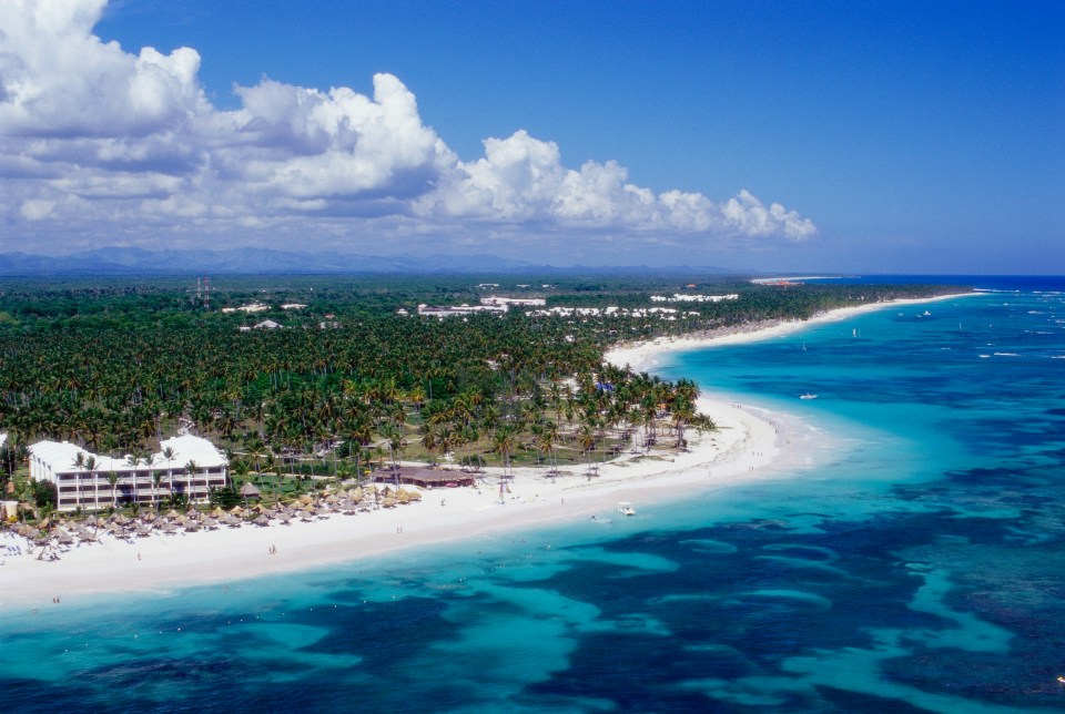 Aerial view of a resort on a tropical beach.