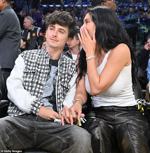 Jenner whispered something in Chalamet's ear at one point in the game