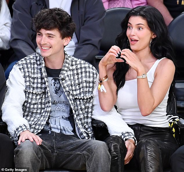 At one point, the Wonka star tenderly placed a hand on Jenner's leg as they shared a laugh during a lull in the action and she gave a heart sign to a player