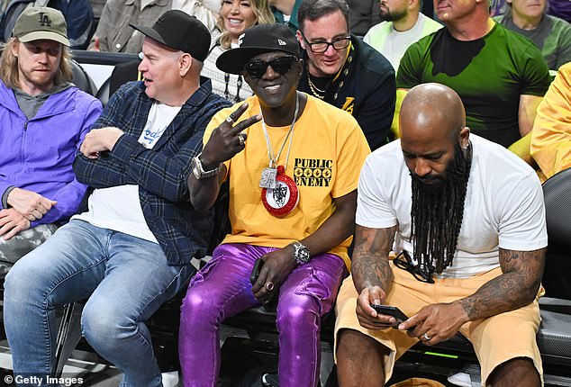 While rapper and reality TV star Flavor Flav also made an unexpected appearance, standing out with his tight metallic purple trousers and his signature clock round his neck