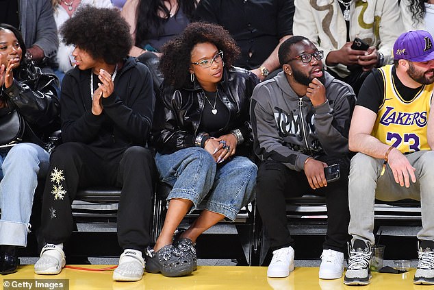 EGOT winner Jennifer Hudson also watched the game courtside, looking effortlessly stylish in a black bomber jacket, jeans and bedazzled crocs