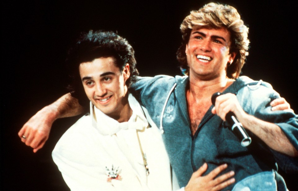 Wham! performing on stage.
