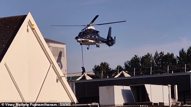 Footage shows the moment two dark blue and white helicopters appeared metres from the supermarket in Baguley, Manchester, this week