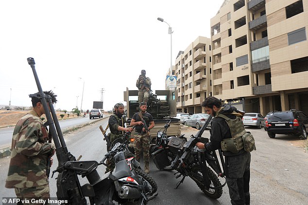 Members of Syria's security forces deploy in an area near the Syrian capital Damascus on April 30, 2025, amid deadly sectarian clashes