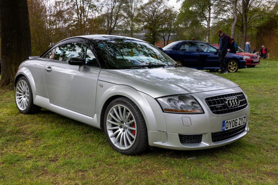 Silver Audi TT quattro Sport on display at a car show.
