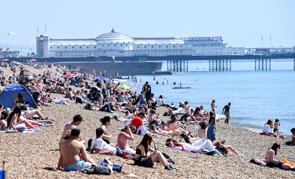 Crowds enjoying a hot day at Brighton beach.