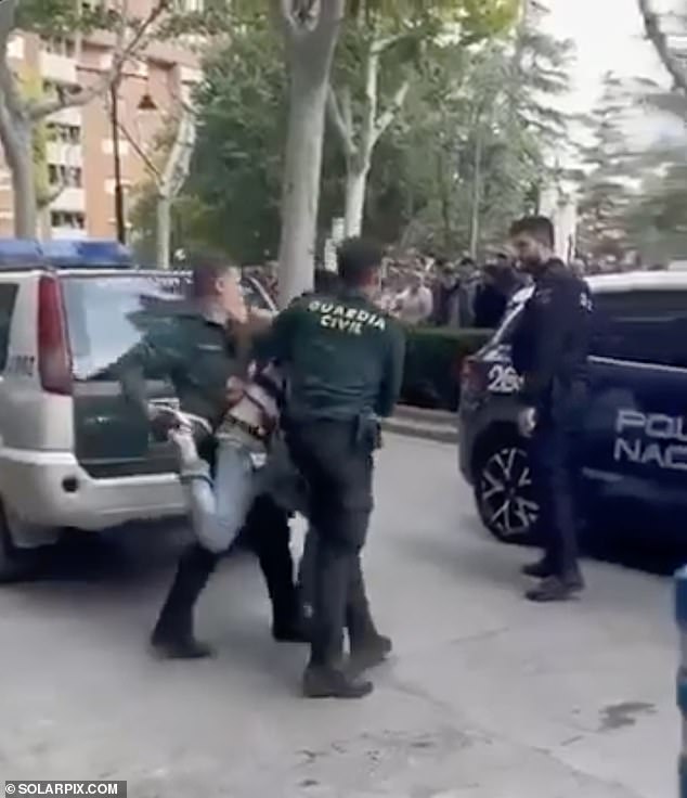 Footage shows the unnamed 49-year-old man being pinned down by Spanish Guardia Civil