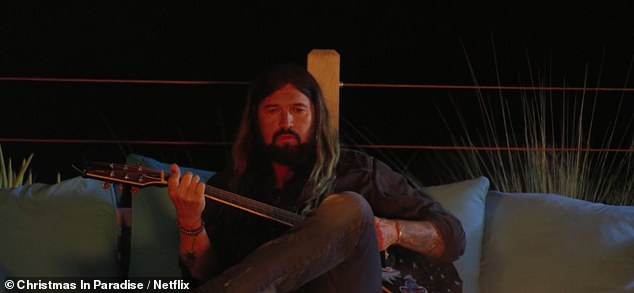 In the film, which was released in December 2022, Elizabeth can be seen lounging across a couch, staring up at Billy as he strummed away in front of a burning fire
