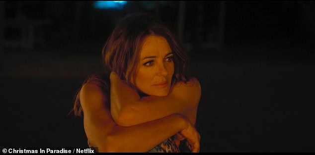 Elizabeth and Billy do not share any romantic scenes together throughout the festive flick, but they do have moments of eye contact and heartfelt conversations