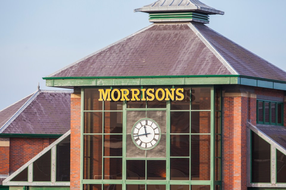 Morrisons supermarket exterior with clock.