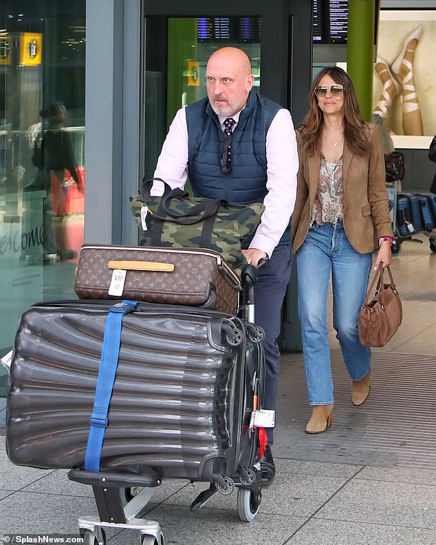 Elizabeth exited the airport with her designer Louis Vuitton luggage and VIP assistance