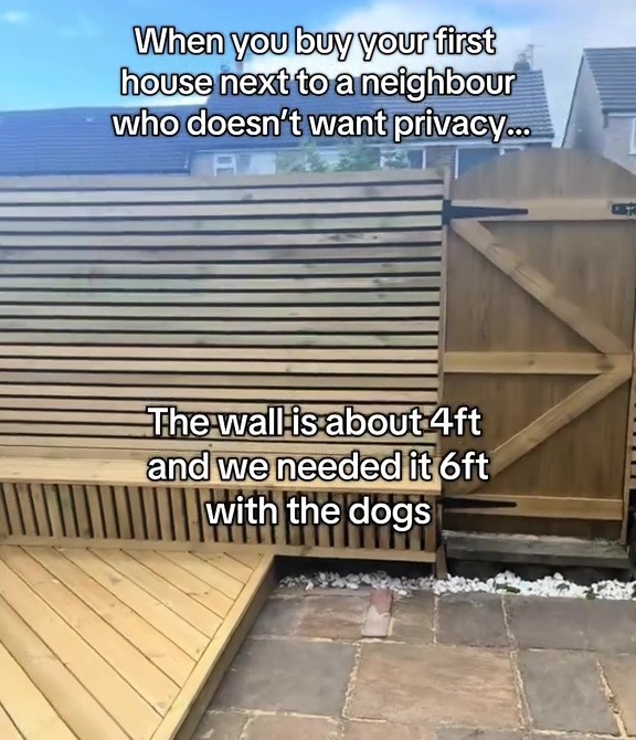 Six-foot-high wooden fence built to contain dogs.