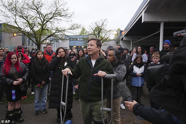 The Psych star was on crutches at a vigil for the victims on Monday as he choked back tears while addressing the crowd as he said: 'What you see here is an injury that means nothing to me because what’s inside my heart is broken. Because my wife passed away behind me at the incident'