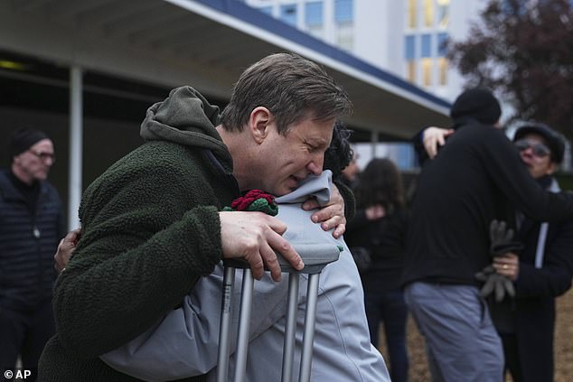 He was consoled by a vigil attendee