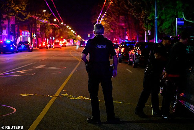 Police work on Fraser street, near the site of the Lapu Lapu day block party -- April 26, 2025