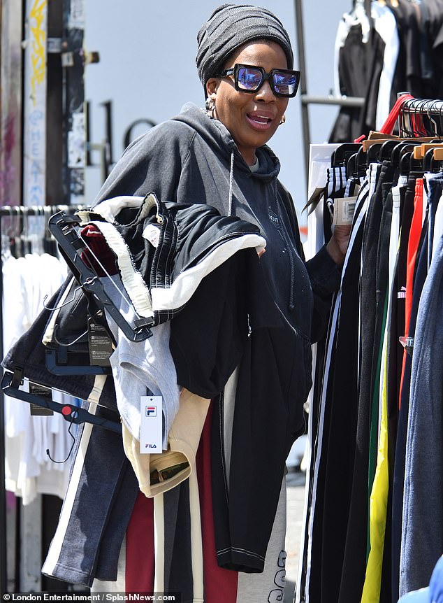 Her shopping excursion appeared to have been a success, as she was seen with several items slung over one of her forearms at the clothes stall