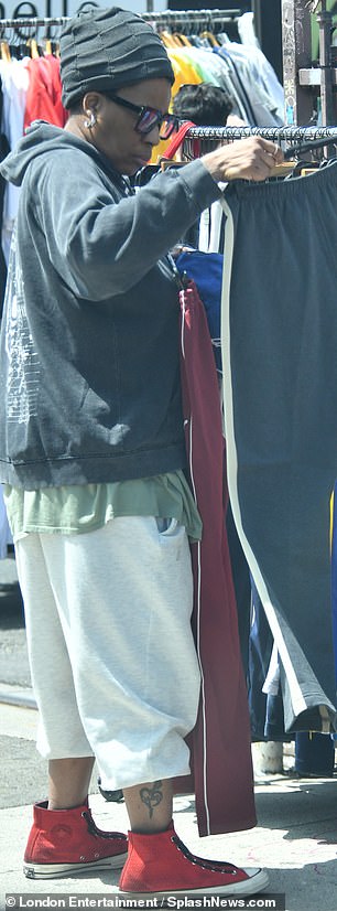In a comfy ensemble including cutoff sweats and a hoodie, she was glimpsed selecting clothes from the rack at an outdoor stall