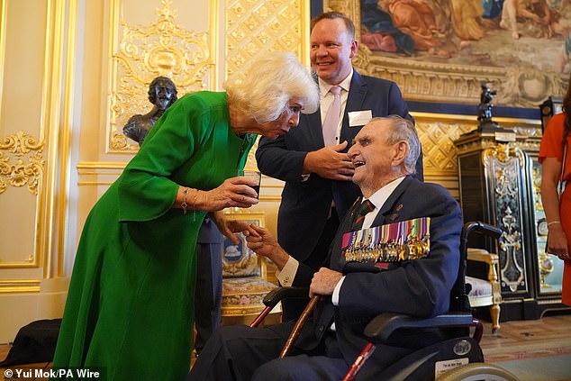 Queen Camilla in conversation with Keith Payne, 92, the oldest member of the association. He was awarded the VC in Vietnam after saving 40 men under heavy mortar fire, who had flown over especially from Australia for the occasion