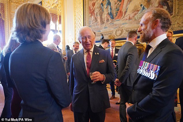 Today's reception for the Victoria and George Cross Association comes one day after the King (centre) issued a moving message about his 'frightening' cancer diagnosis on Wednesday