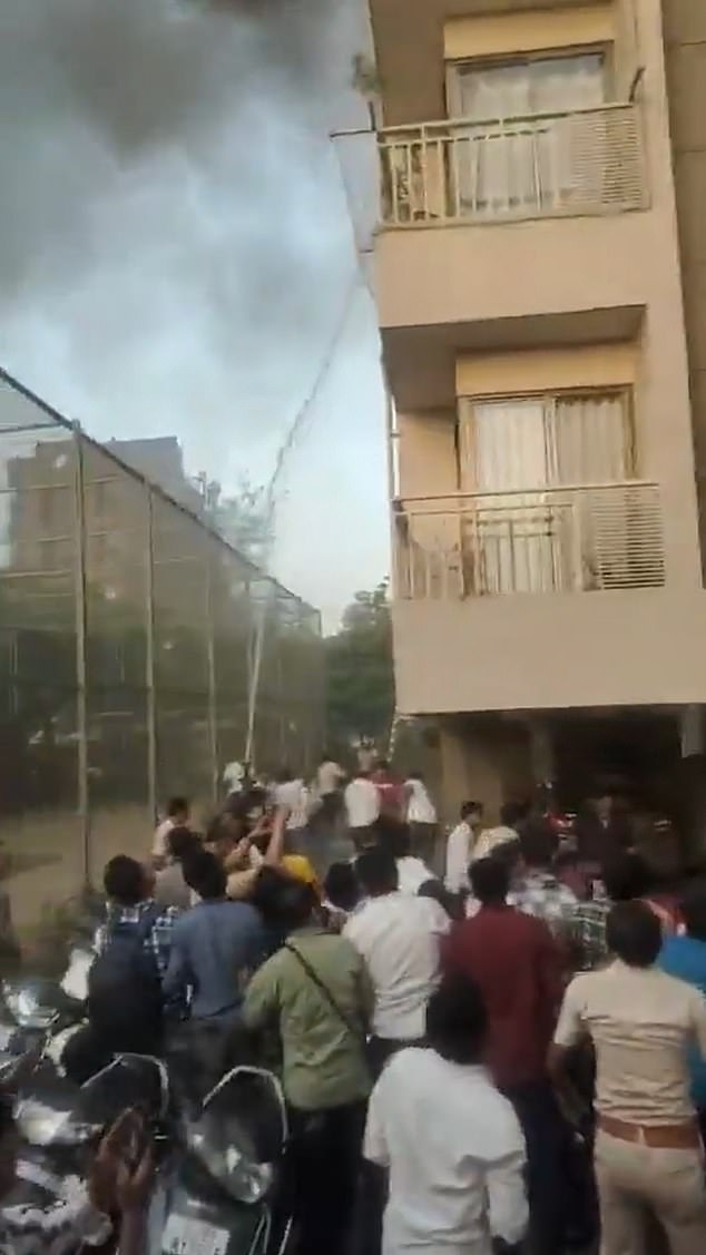 Firefighters rushed to the scene and were seen using a hose to try and control the roaring fire