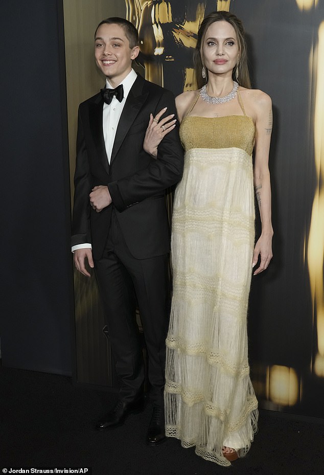Knox appeared to have experienced a growth spurt since escorting Angelina to the 15th Governors Awards in LA on November 17
