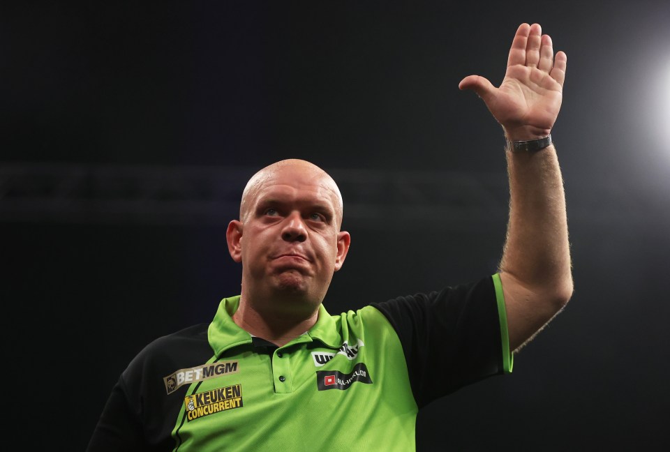 Michael van Gerwen reacting during a darts match.