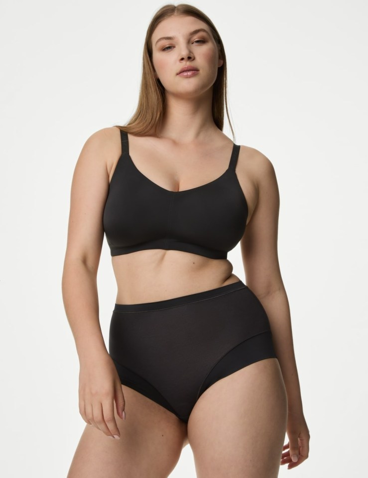 Model wearing a black Flexifit non-wired full-cup bra and high-waisted briefs.