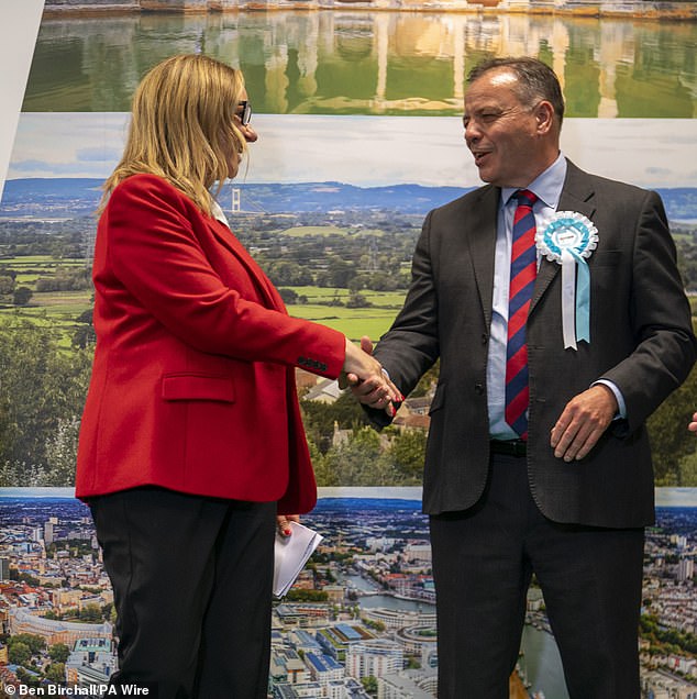 Successful Labour Party candidate Helen Godwin shakes Aaron Banks' hand after it is announced she won the Mayor of West of England election