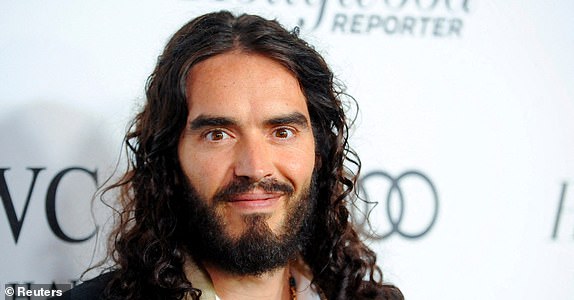 FILE PHOTO: British actor and comedian Russell Brand arrives at the 2nd Annual Reel Stories, Real Lives event benefiting the Motion Picture & Television Fund in Los Angeles, California October 20, 2012. REUTERS/Gus Ruelas/File Photo